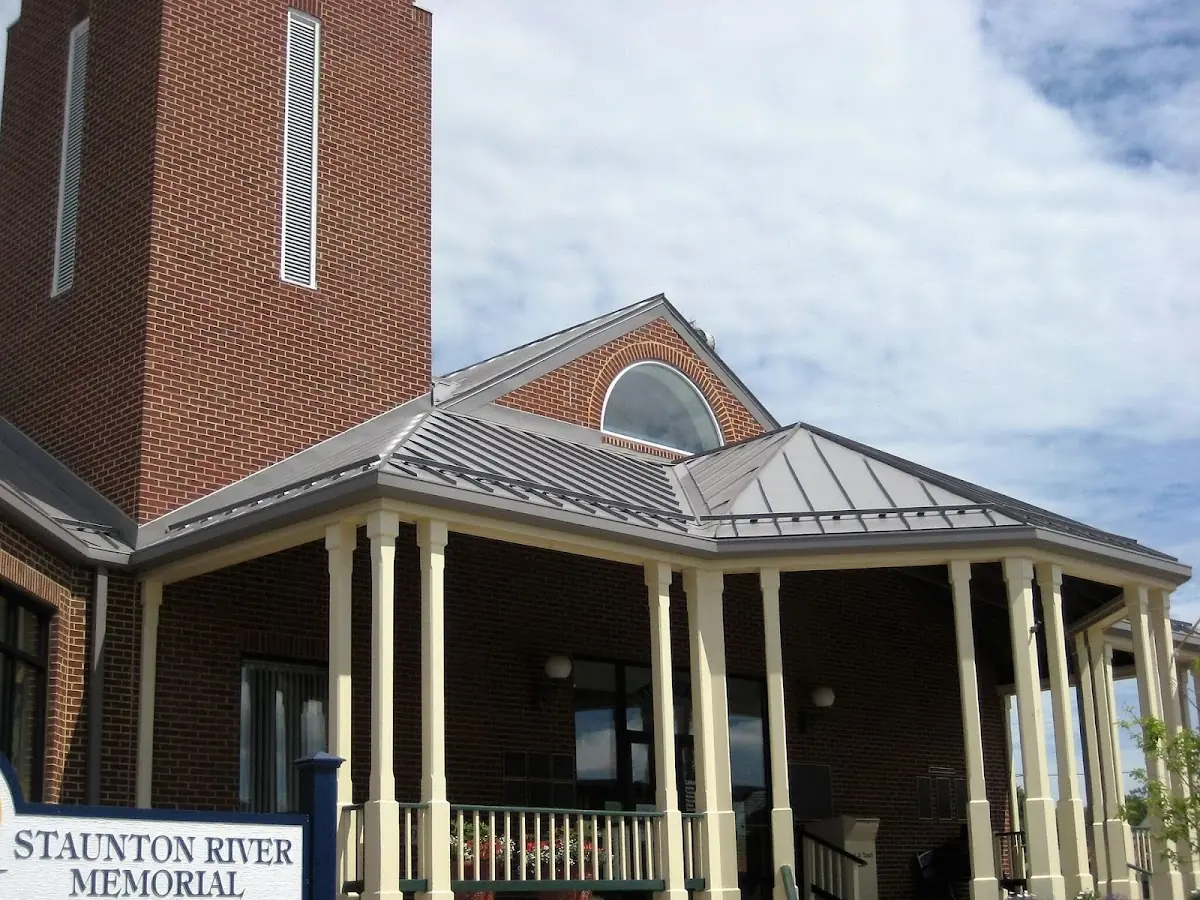 Skilled roofing craftsmen working on a residential roof in Bucksport